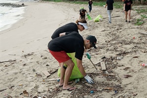 Cleaning the beach at East Coast Park